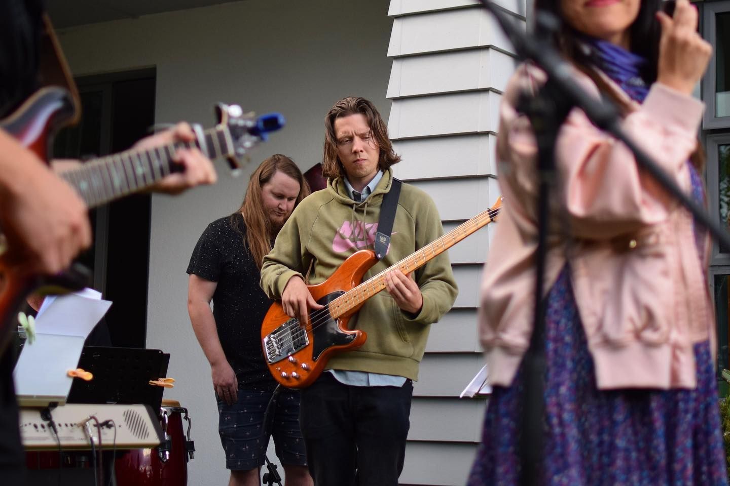 Alex playing bass with a band