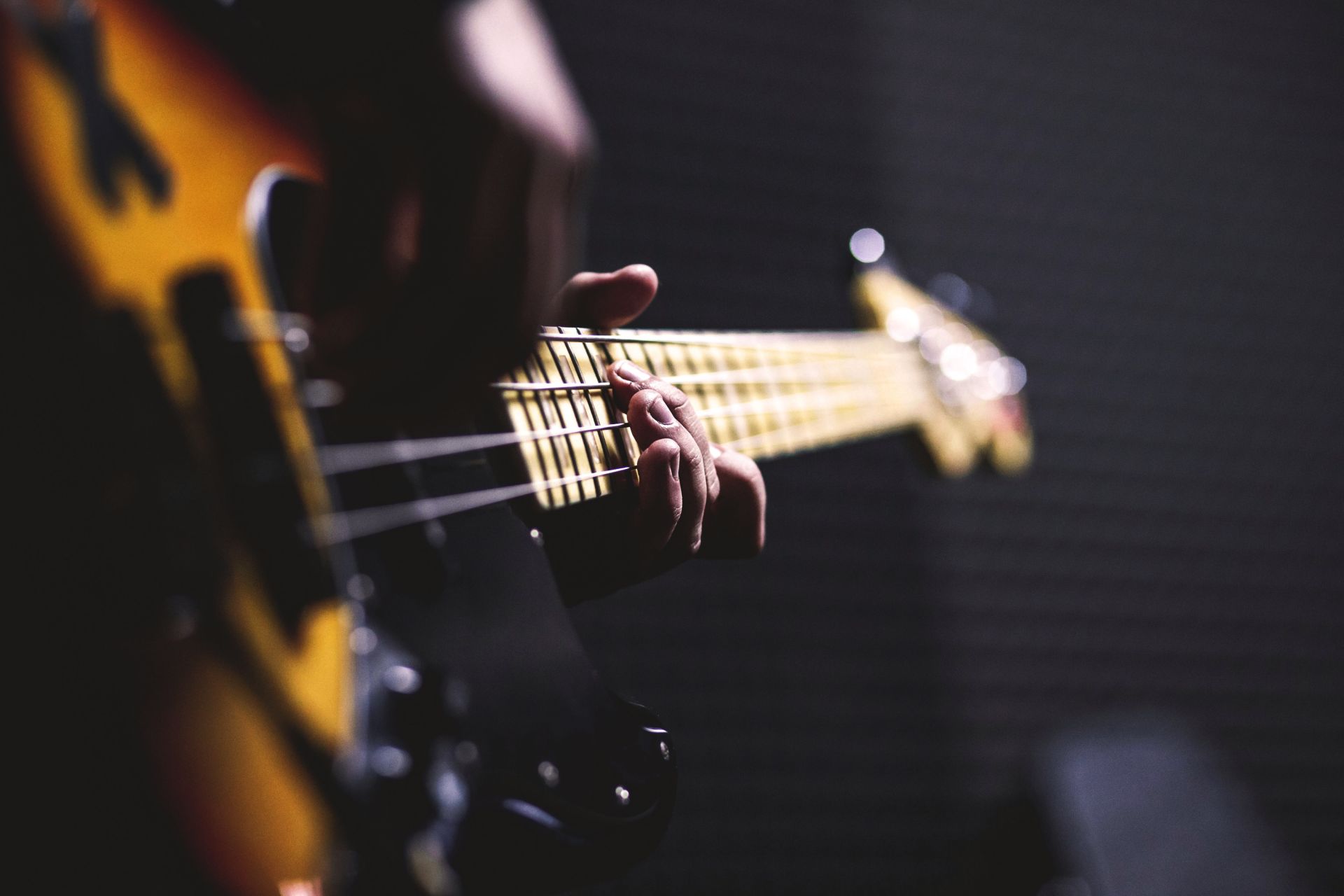 A guitarist playing live